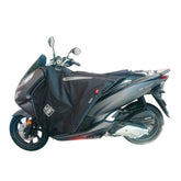Coprigambe Termoscud R202X, un coprigambe impermeabile con fodera termica. In uso su scooter. Di Tucano Urbano.
